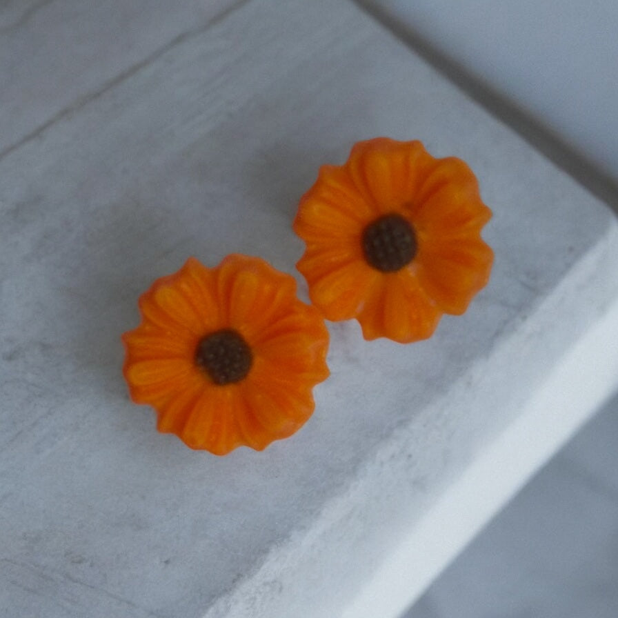 Flower Charms Orange With Brown Center